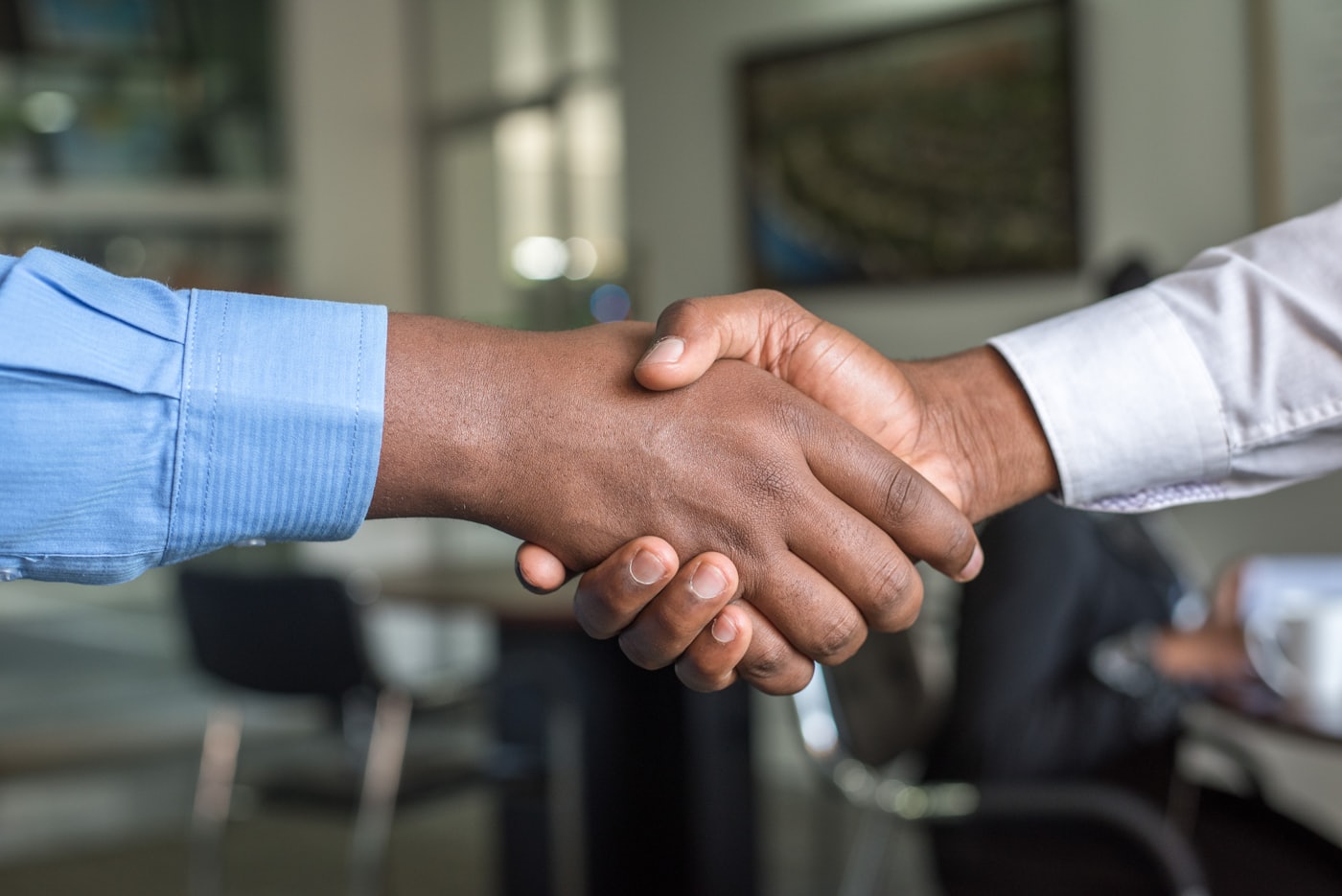 A friendly handshake after reaching an agreement